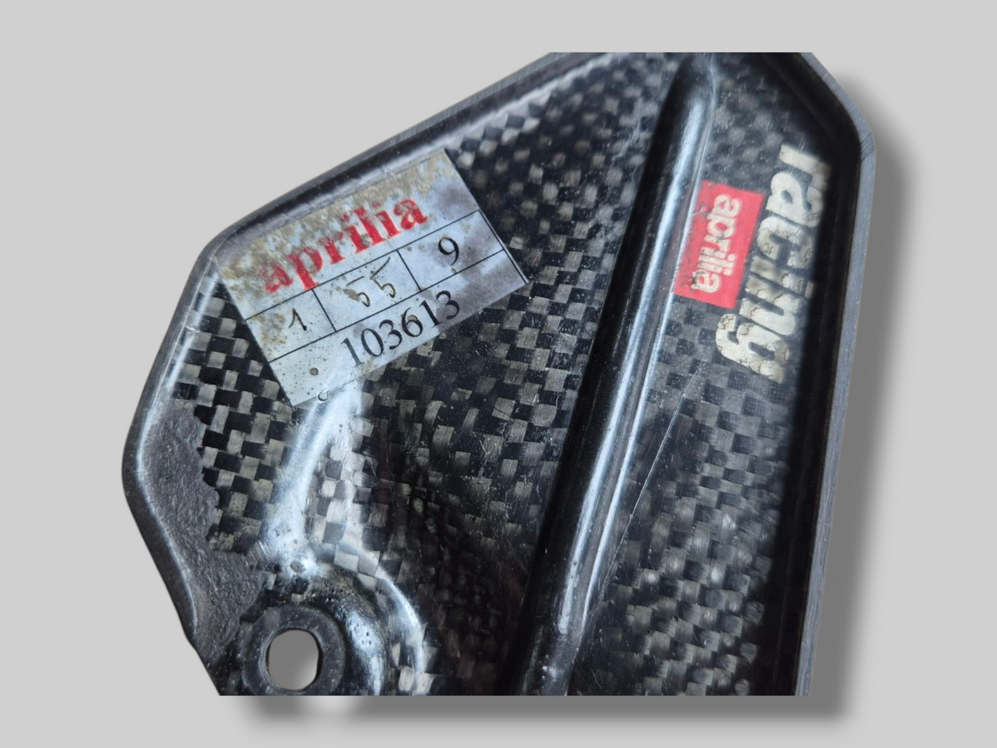LEFT-HAND CARBON HEELPLATE AP8791053 Aprilia RSV Mille 98-03 / Tuono 02-05 / RSV1000R 04-10